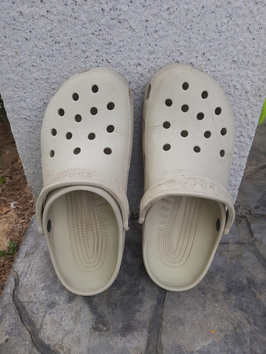 Close-up of Bone Crocs toe box showing light creases and scuff marks after wear